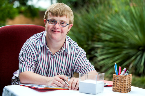 Young man with Down syndrome working